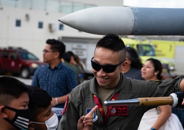 Cope North exercise participants &quot;Pet the Jet&quot; event with Guam elementary students
