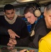 Sailors manipulate the Ouija board in Flight Deck Control