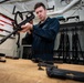 Sailor conducts a function check on an M16 rifle