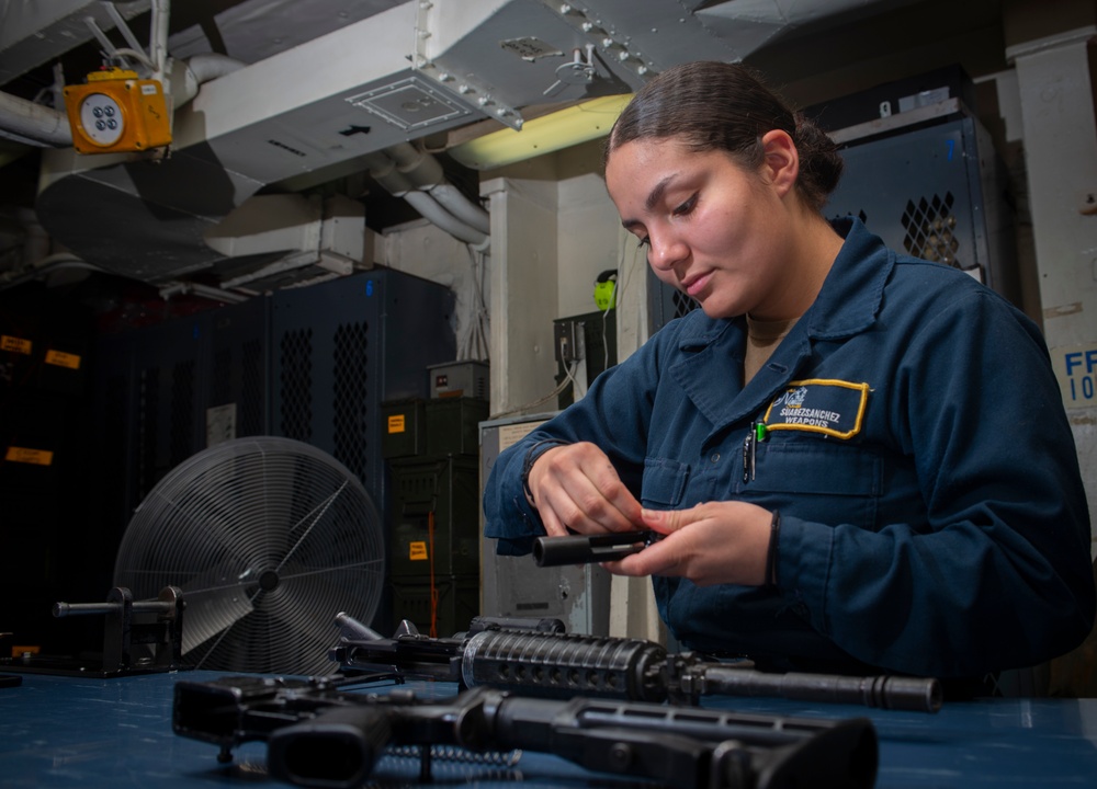 Sailor Performs A Safety Check On M4 Rifle