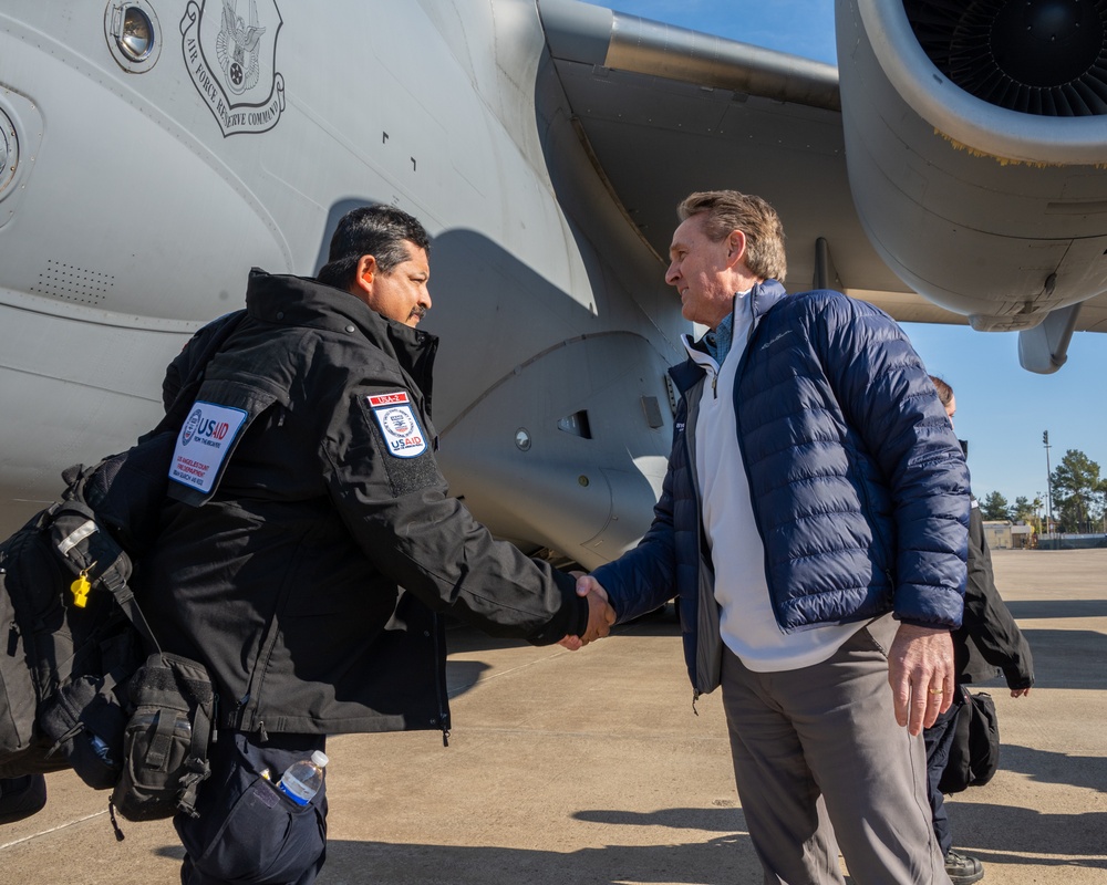 U.S. Ambassador Jeffry Flake greets USAID volunteers arriving to Incirlik AB