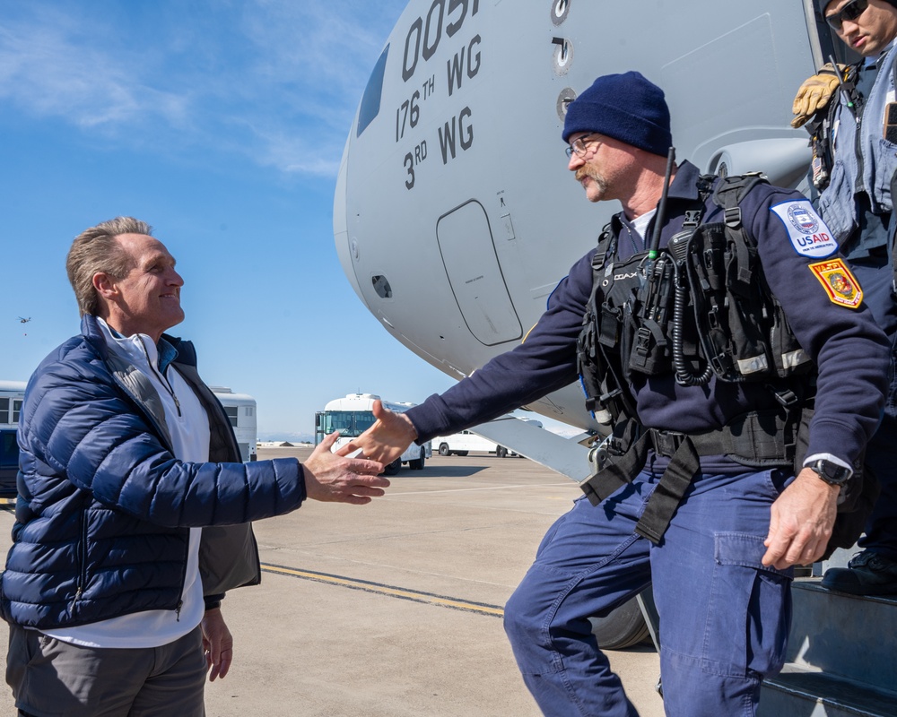 U.S. Ambassador Jeffry Flake greets USAID volunteers arriving to Incirlik AB