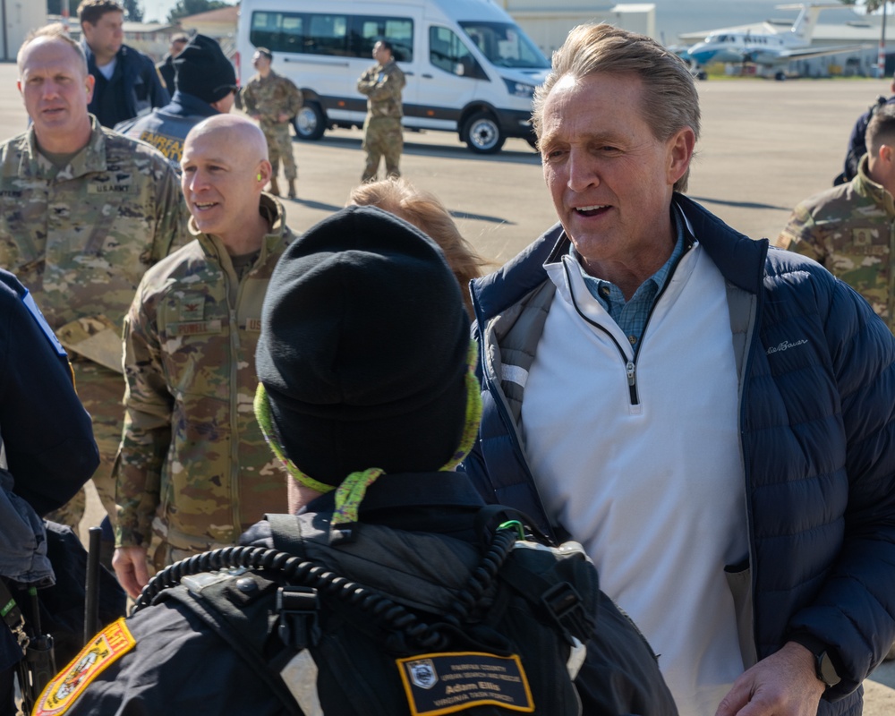 U.S. Ambassador Jeffry Flake greets USAID volunteers arriving to Incirlik AB