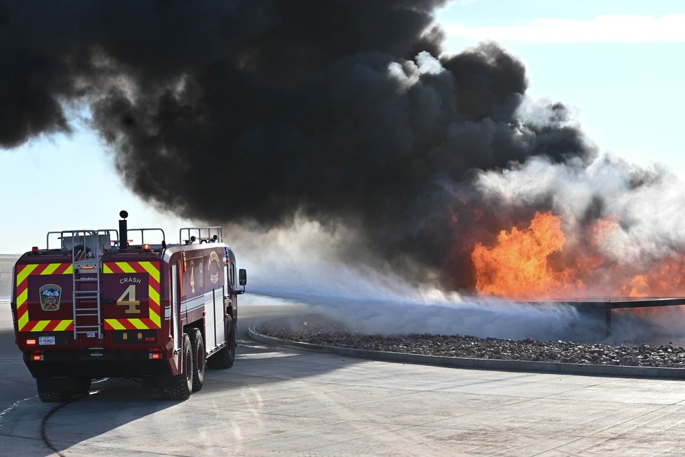 Ellsworth Air Force Base firefighters perform training exercise with burn pit