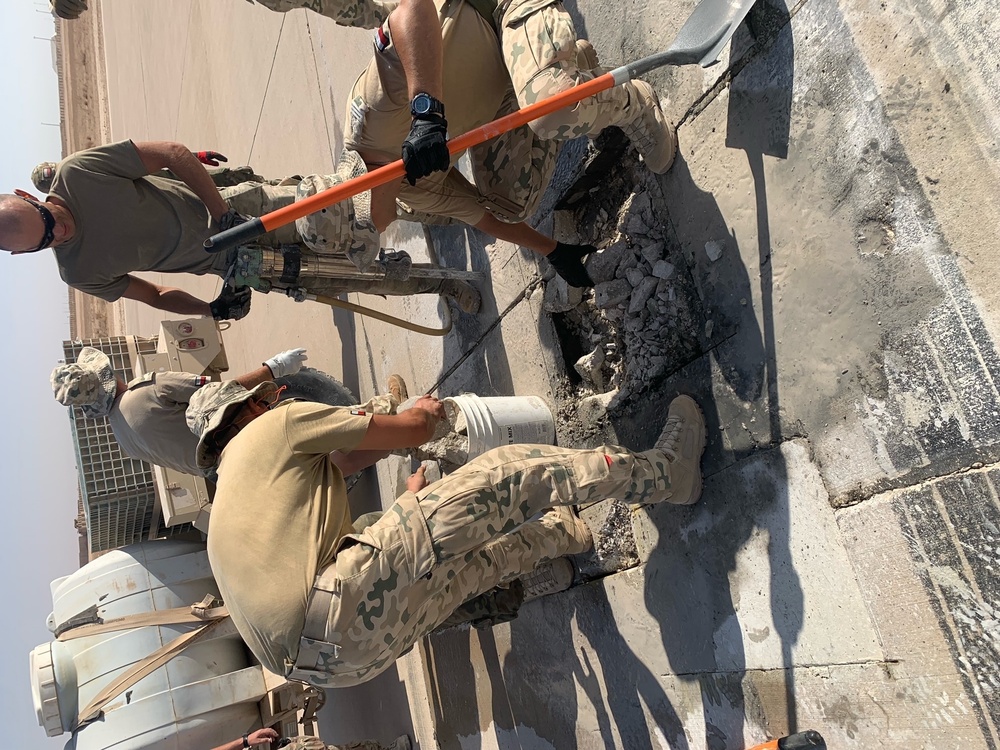 Polish Army engineers participate in US Air Force airﬁeld repair operations.