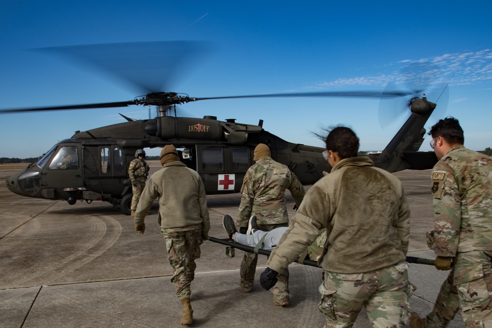 302nd Aeromedical Staging Squadron Airmen Transport Simulated Patient
