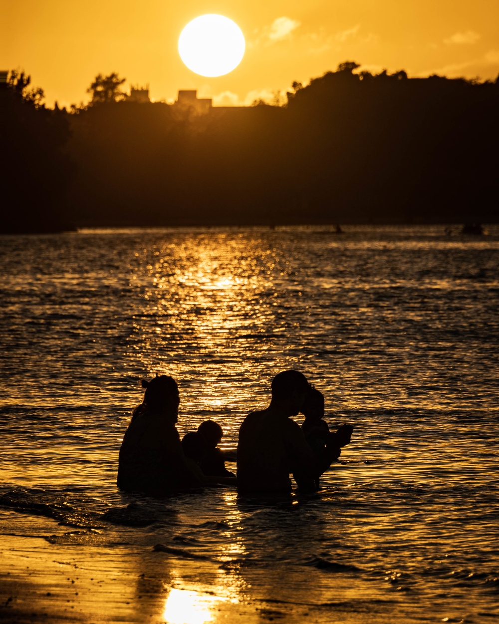 Residents and travelers visit the beaches of Guam