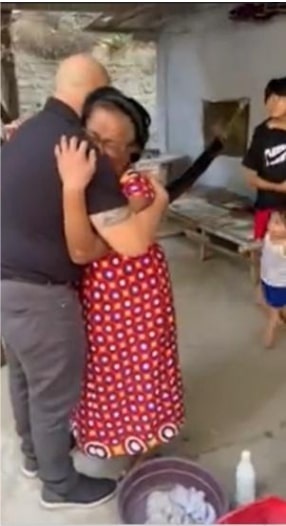 Sgt. 1st Class Christian Araza and his grandmother, Julie Flores, share an embrace after seeing each other for the first time in seven years.