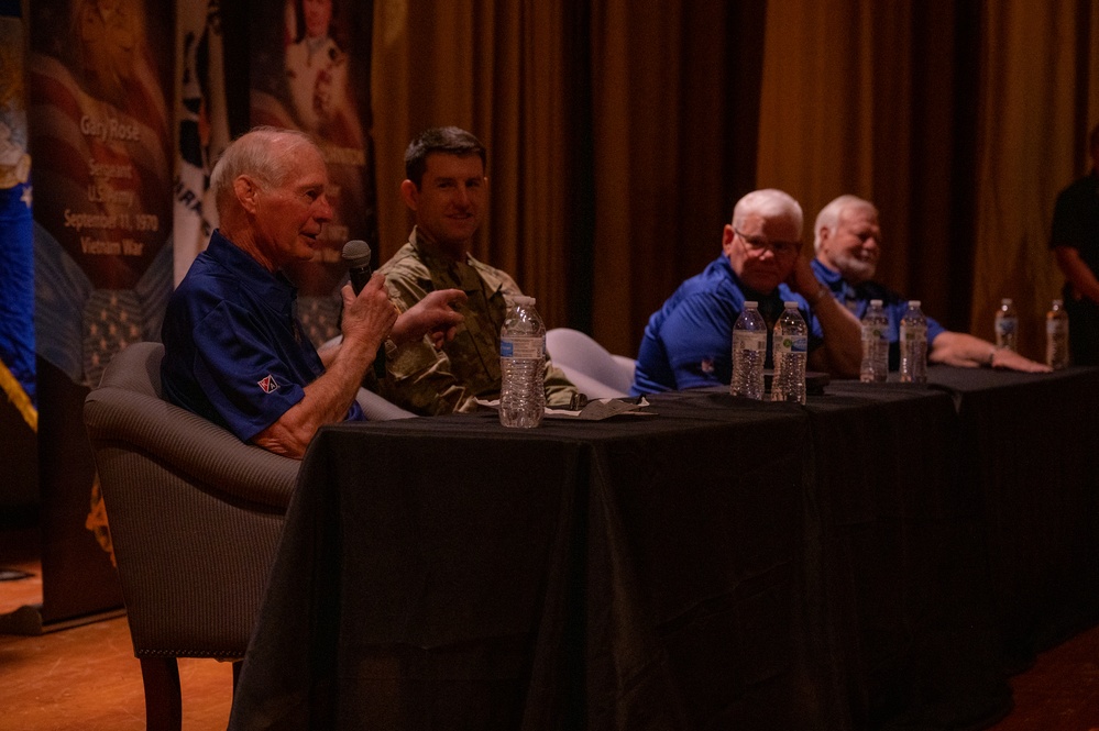 Luke holds Medal of Honor panel