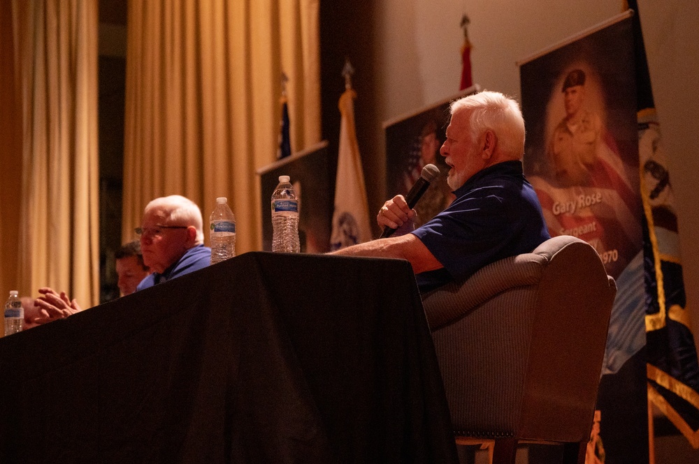 Luke holds Medal of Honor panel