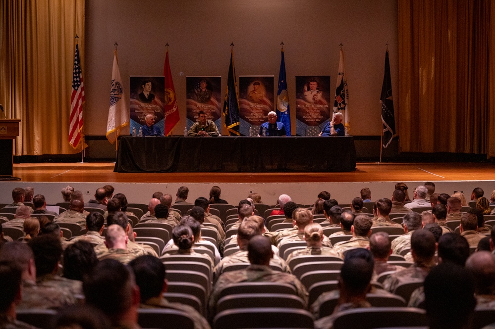 Luke holds Medal of Honor panel