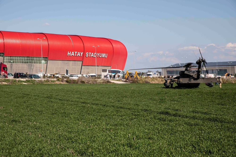 U.S. Army UH-60 Blackhawks transport USAID Disaster Assistance Response Teams