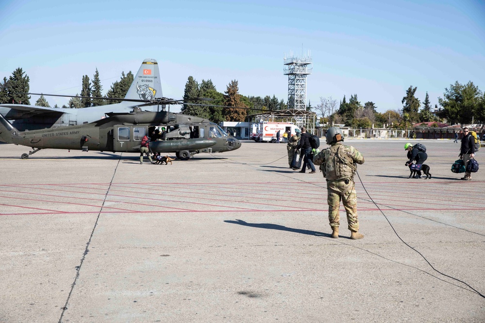 U.S. Army UH-60 Blackhawks transport USAID Disaster Assistance Response Teams