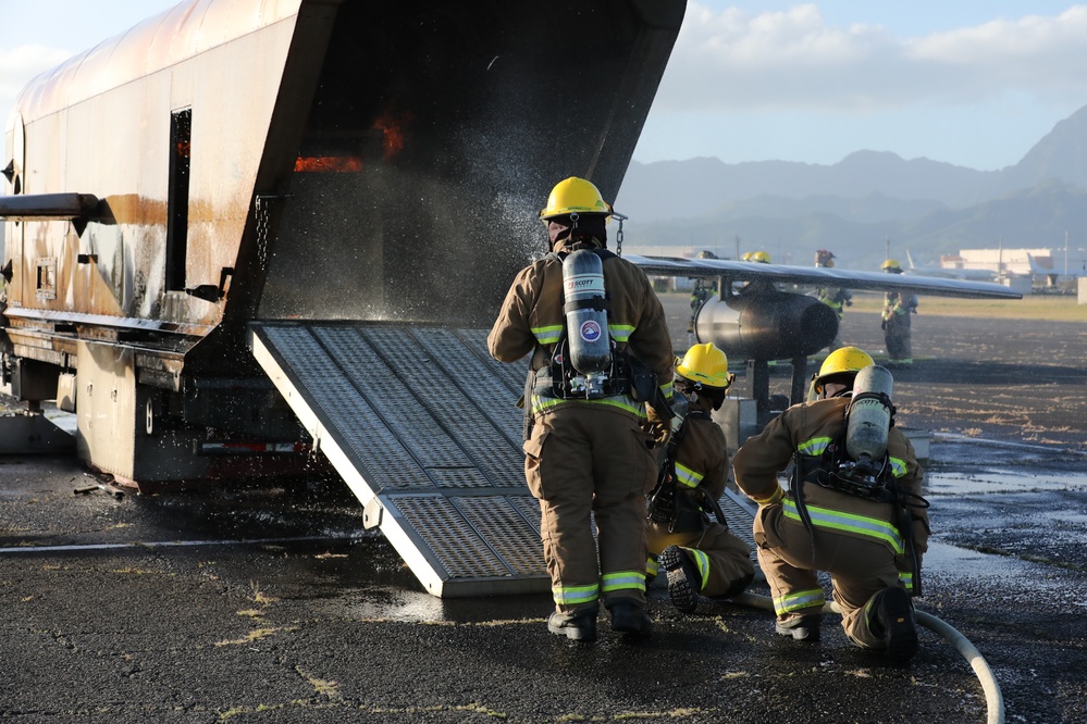 Hawaii Army National Guard, Air Force Reserve and Marine Corps Firefighters conduct a joint training exercise at Kaneohe Marine Air Station.