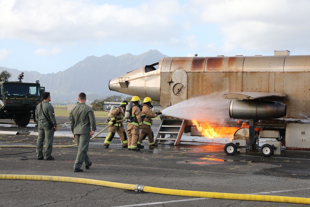 Hawaii Army National Guard, Air Force Reserve and Marine Corps Firefighters conduct a joint training exercise at Kaneohe Marine Air Station.