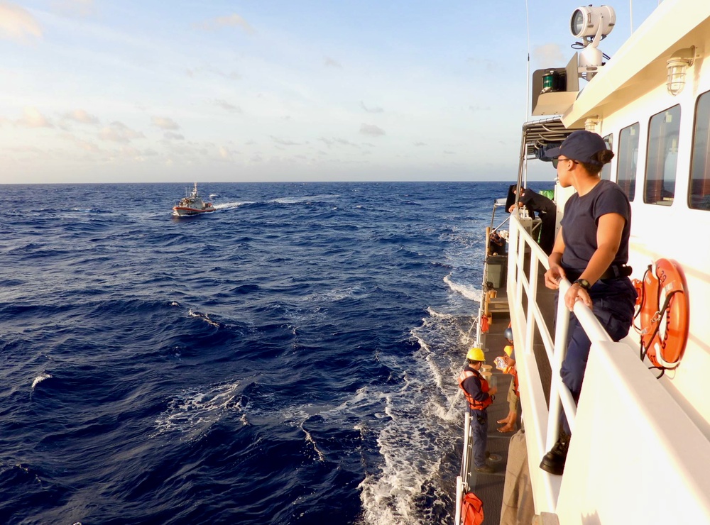 USCGC Myrtle Hazard crew transfers two mariners rescued from the water