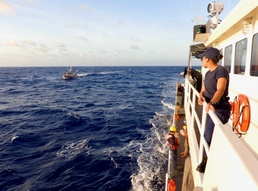 USCGC Myrtle Hazard crew transfers two mariners rescued from the water