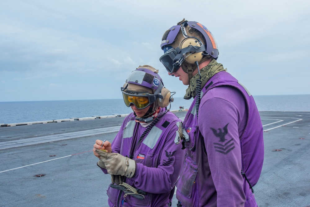 U.S. Navy Sailors Review Fuel Readings