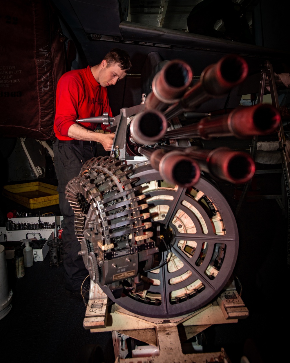 Sailor Inspects Aircraft Gun