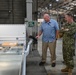 Capt. David Carnal, commanding officer, NAVSUP Business Systems Center, participates in a vertical lift module demonstration with representatives from NAVSUP Fleet Logistics Center San Diego, during a visit to the area, Feb. 6.