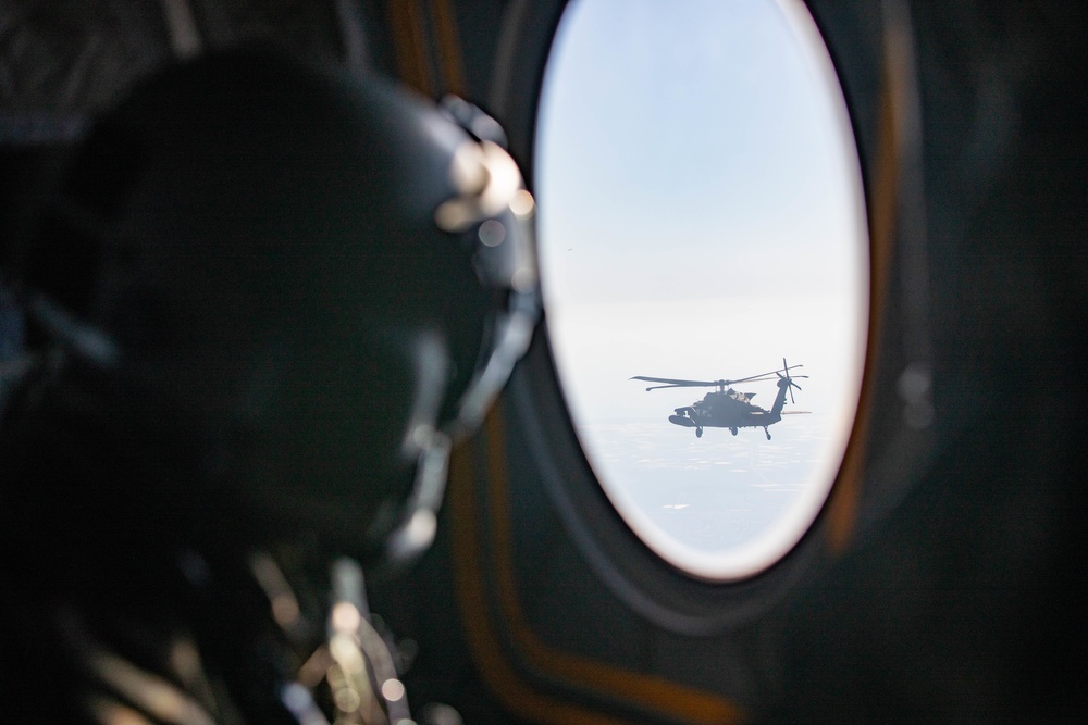 U.S. Army Soldier Looks out the window of a CH-47 Chinook