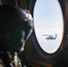 U.S. Army Soldier Looks out the window of a CH-47 Chinook