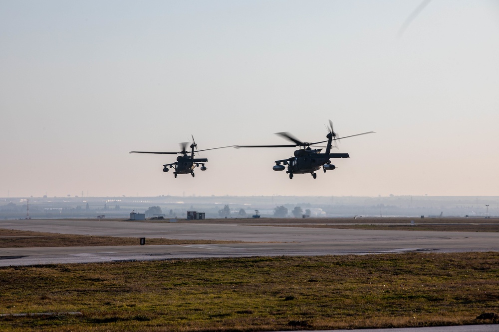 U.S. Army UH-60M Blackhawks preform survey mission