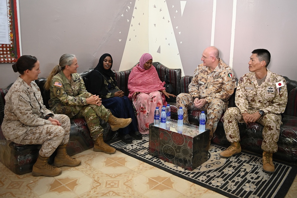 Commanding General of Combined Joint Task Force – Horn of Africa reads to children at the Balbala 3 School