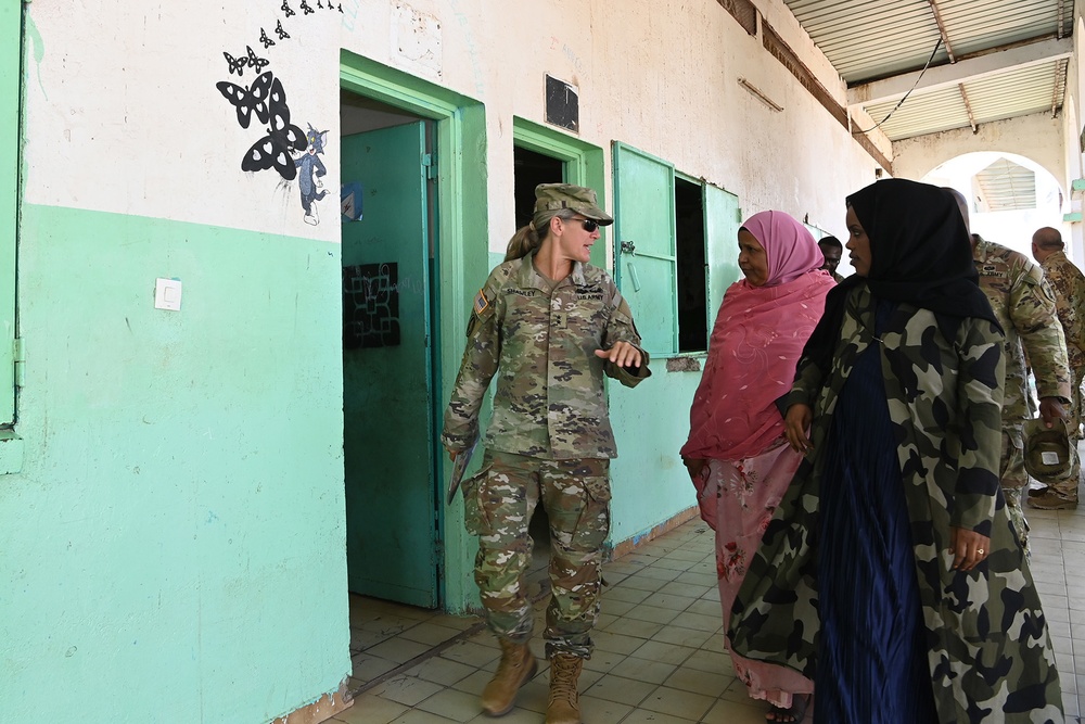 Commanding General of Combined Joint Task Force – Horn of Africa reads to children at the Balbala 3 School