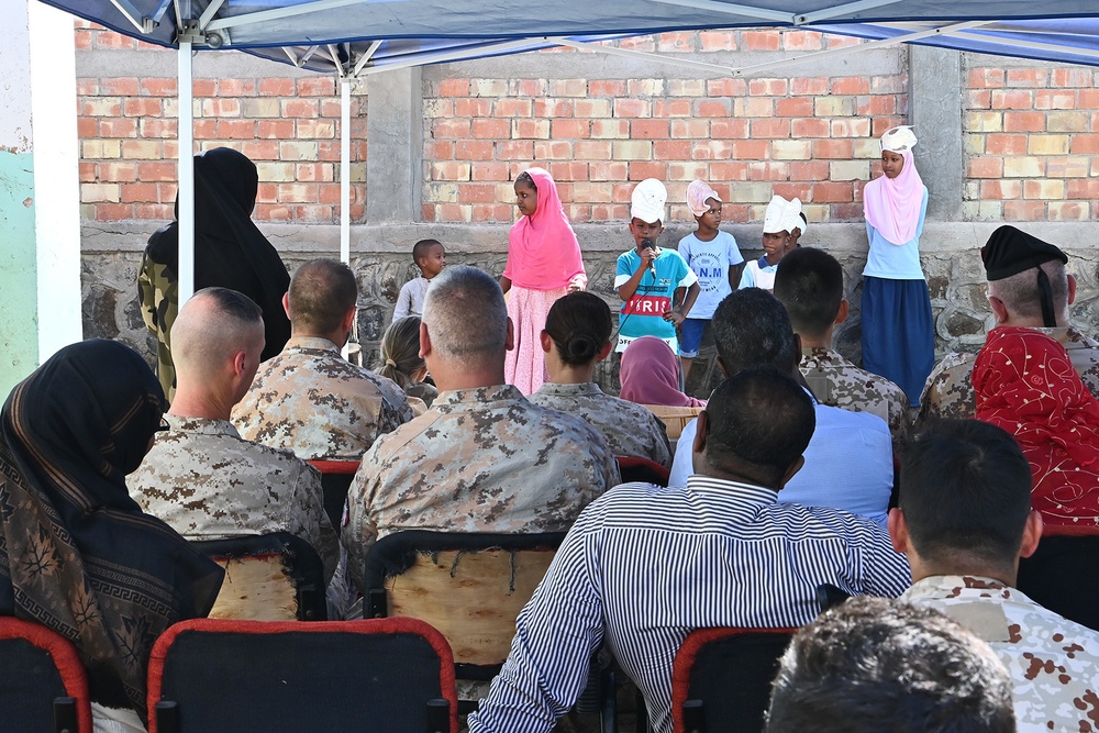 Commanding General of Combined Joint Task Force – Horn of Africa reads to children at the Balbala 3 School