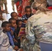Commanding General of Combined Joint Task Force – Horn of Africa reads to children at the Balbala 3 School