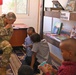 Commanding General of Combined Joint Task Force – Horn of Africa reads to children at the Balbala 3 School
