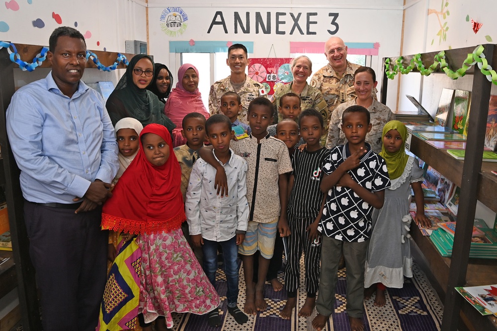 Commanding General of Combined Joint Task Force – Horn of Africa reads to children at the Balbala 3 School