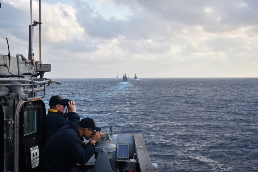 USS Antietam (CG 54) Sails in Column Formation During Submarine Familiarization Exercise