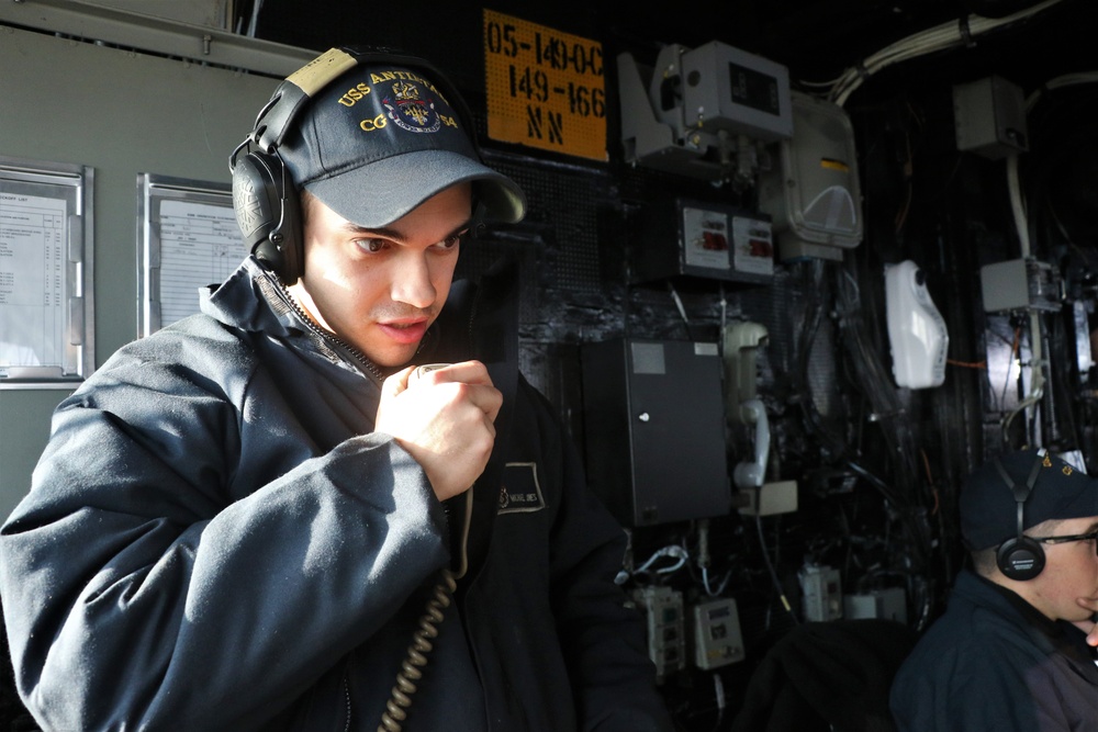 USS Antietam (CG 54) Gunner's Mate Coordinates Machine Gun Firing During Live-Fire Exercise