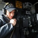 USS Antietam (CG 54) Gunner's Mate Coordinates Machine Gun Firing During Live-Fire Exercise