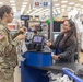 Soldier clips on: 11th ADA Bde. Soldier saves at the register, helps others