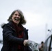 Beeman family member breaks champagne bottle christening USACE survey vessel Beeman