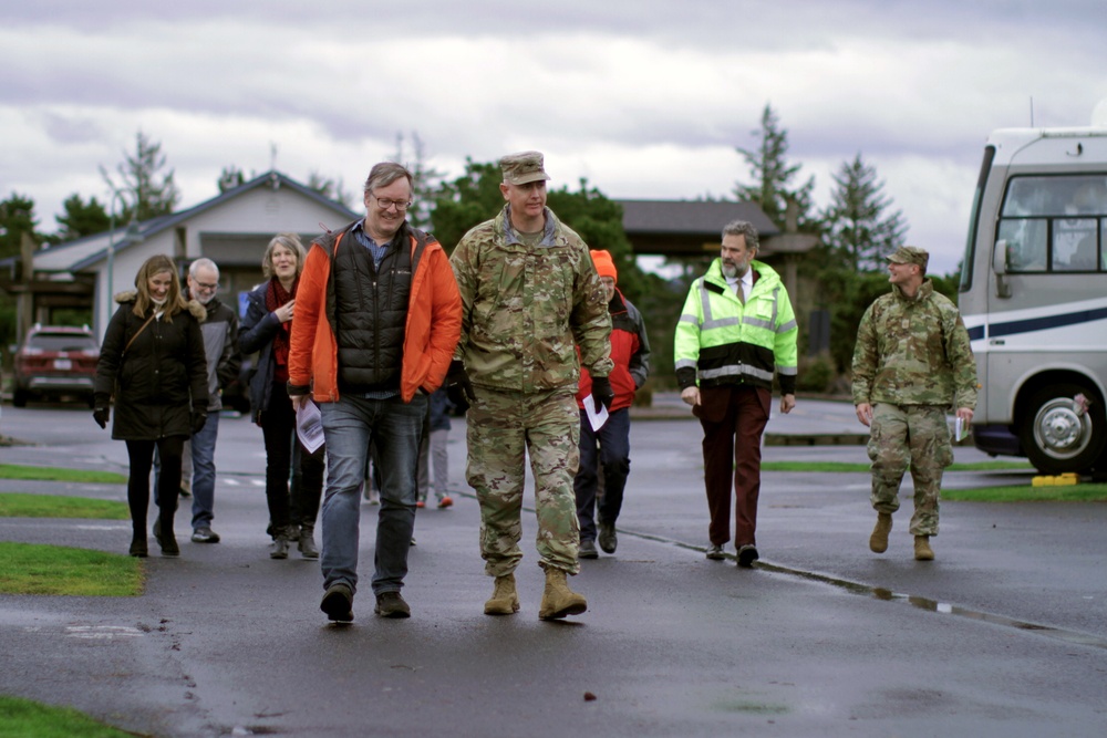 Beeman family members walk with district commander, Col. Helton, to christen USACE survey vessel Beeman.