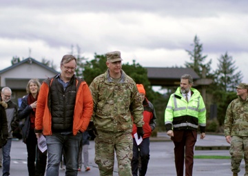 Beeman family members walk with district commander, Col. Helton, to christen USACE survey vessel Beeman.