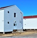 Contractors moving four World War II-era barracks buildings at Fort McCoy