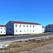 Contractors moving four World War II-era barracks buildings at Fort McCoy