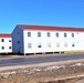 Contractors moving four World War II-era barracks buildings at Fort McCoy