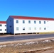 Contractors moving four World War II-era barracks buildings at Fort McCoy