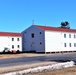 Contractors moving four World War II-era barracks buildings at Fort McCoy