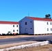 Contractors moving four World War II-era barracks buildings at Fort McCoy