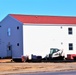 Contractors moving four World War II-era barracks buildings at Fort McCoy