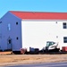 Contractors moving four World War II-era barracks buildings at Fort McCoy