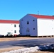 Contractors moving four World War II-era barracks buildings at Fort McCoy