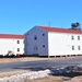 Contractors moving four World War II-era barracks buildings at Fort McCoy